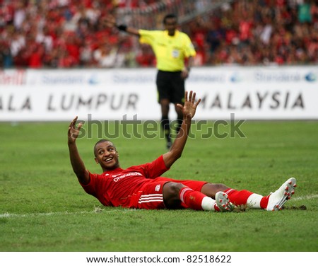 BUKIT JALIL, MALAYSIA-  JULY 16: Liverpool\'s David Ngog celebrates after scoring a goal in the game against Malaysia at the National Stadium on July 16, 2011, Bukit Jalil, Malaysia. Liverpool won 6-3.