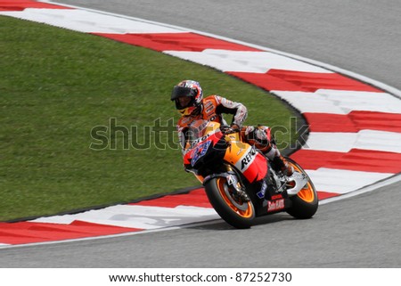 SEPANG, MALAYSIA - OCTOBER 22: 2011 MotoGP champion Casey Stoner competes during qualifying session of the Shell Advance Malaysian Motorcycle Grand Prix 2011 on October 22, 2011 at Sepang, Malaysia.