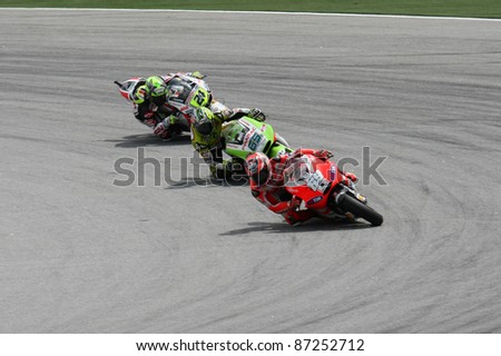 SEPANG, MALAYSIA- OCTOBER 22: 2011 MotoGP riders follow the slipstream of Nicky Hayden (69) during qualifying of the Shell Advance Malaysian Motorcycle GP 2011 on October 22, 2011 at Sepang, Malaysia.