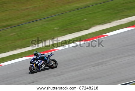 SEPANG, MALAYSIA - OCTOBER 22: MotoGP rider Ben Spies of the USA sprints during the qualifying session at the Shell Advance Malaysian Motorcycle GP 2011 on October 22, 2011 at Sepang, Malaysia.