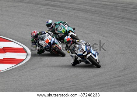 SEPANG, MALAYSIA - OCTOBER 22: Moto2 riders Kenny Noyes (9) and M Zamri (97) competes at the qualifying event of the Shell Advance Malaysian Motorcycle GP 2011 on October 22, 2011 at Sepang, Malaysia.