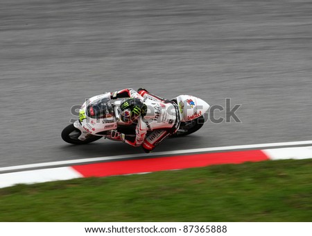 SEPANG, MALAYSIA - OCTOBER 23: 125cc rider Sandro Cortese competes on race day of the Shell Advance Malaysian Motorcycle Grand Prix 2011 on October 23, 2011 at Sepang, Malaysia.