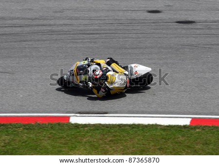 SEPANG, MALAYSIA - OCTOBER 23: Moto2 rider Thomas Luthis of Switzerland competes at the Shell Advance Malaysian Motorcycle GP 2011 on October 23, 2011 at Sepang, Malaysia. He went on to win this race.