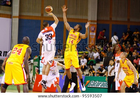 KUALA LUMPUR - FEBRUARY 19: Tip off in the match between Malaysian Dragons and Singapore Slingers at the ASEAN Basketball League match on February 19, 2012 in Kuala Lumpur, Malaysia. Dragons won 86-71.