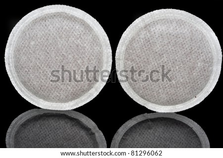 Coffee pods with integral grains of coffee.