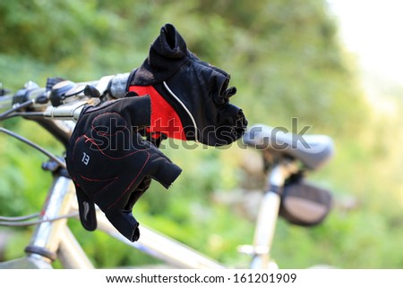 Bicycle gloves close up against bicycle frame