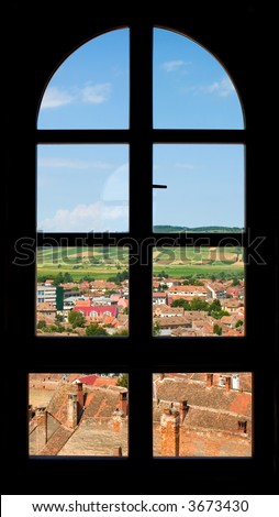 Outlook through castle window to the historic city