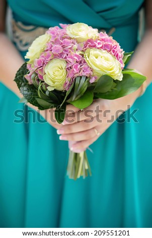 woman holding on to a beautiful flower bouquet