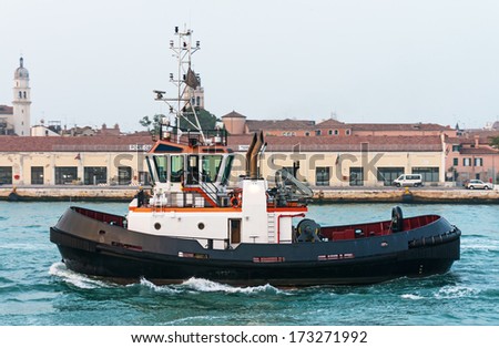 Tug boat in front of the old port terminal in Venice, Italy