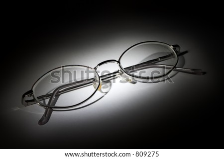 Closed glasses on white background in the darkness