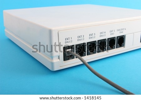 Cable plugged into extension one on a small home or office PABX system.