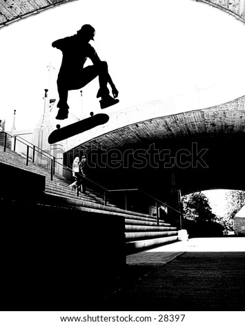 Skateboard silhouette doing a kickflip