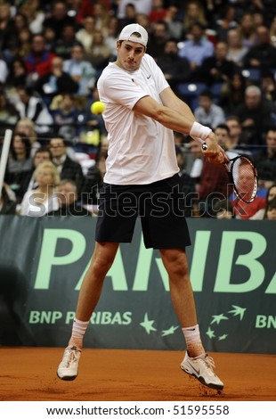 BELGRADE - MARCH 7: John Isner returns the ball during the Davis Cup World Group first round tennis match against Novak Djokovici in Belgrade Arena March 7, 2010 in Belgrade, Serbia.