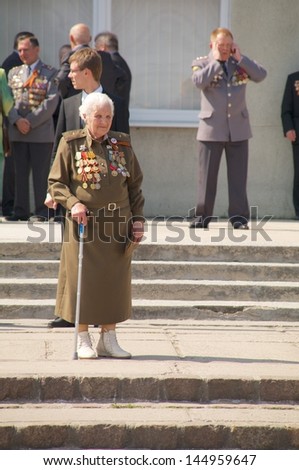 KALININGRAD, RUSSIA - MAY 07:  senior woman veteran of the World War II with her medals at street on during the victory celebration in World War II on May 07, 2013 in Kaliningrad, Russia