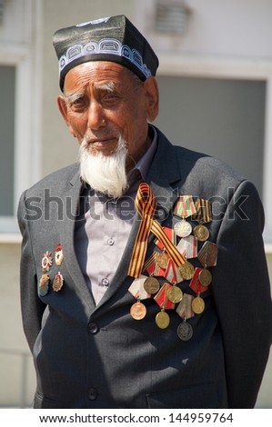 KALININGRAD, RUSSIA - MAY 07: veteran of the World War II with his medals at street on during the victory celebration in World War II on May 07, 2013 in Kaliningrad, Russia