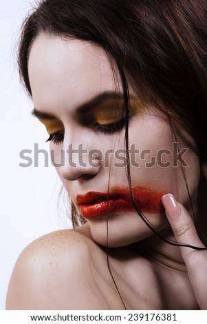 beautiful young woman with smeared lipstick