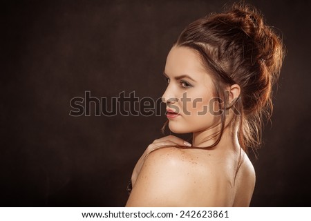 sad topless girl looking over shoulder