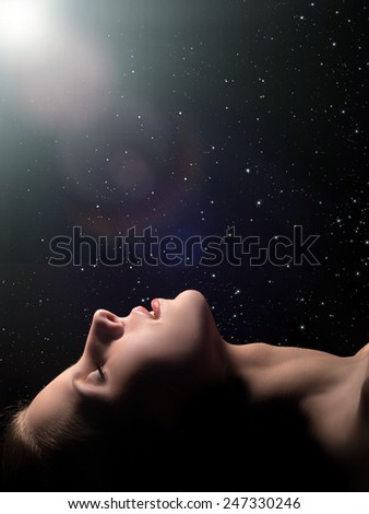 sensual sleeping woman profile on black background