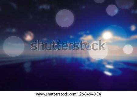 sun and moon over island blurred background