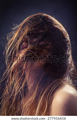 woman with fluffy wet hair toned image