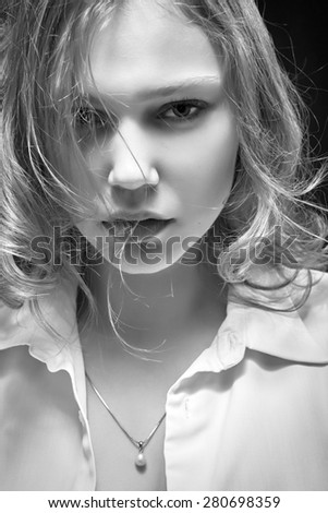 sad woman portrait on black background monochrome