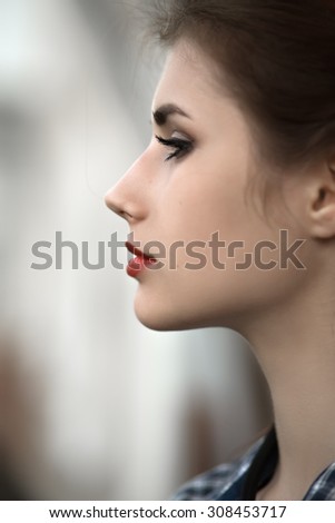 sad woman profile silhouette on blurred background