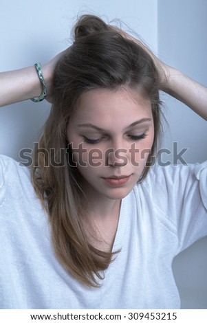 pensive sad young woman with long hairs