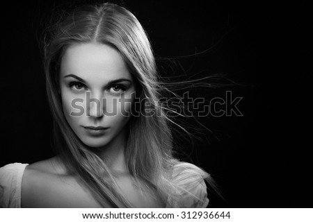 luxury blond girl on black background, monochrome