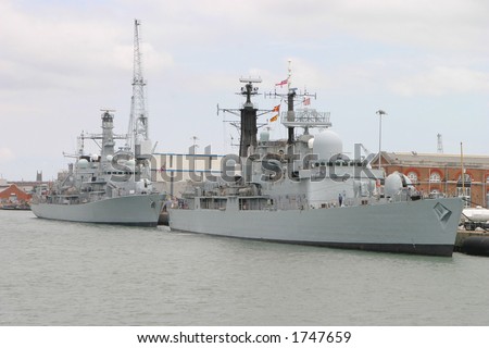 Naval ships in Portsmouth dockyard, England