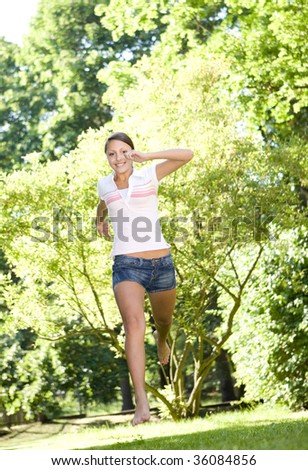 happy attractive young woman active in park