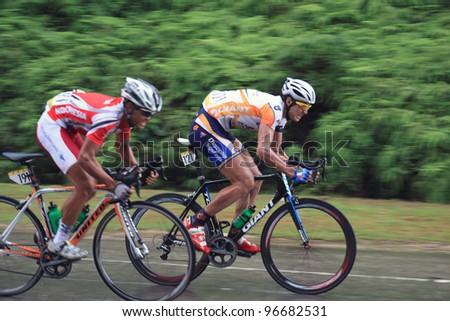 KUANTAN-MARCH 2: Hao Liu (MAX Success Sports) & Wijaya Endra (Indonesia Team) in action during Stage 8 of the le Tour de Langkawi from Bentong to Kuantan on March 2, 2012 in Kuantan, Pahang, Malaysia.