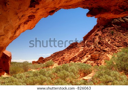 Under Mushroom Rock:  Rock formations frame a vivid blue sky in this desert landscape with space for your copy.