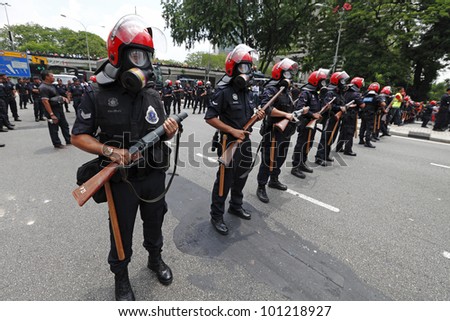 KUALA LUMPUR, MALAYSIA - APRIL 28: Riot police at the protest rally organized by the coalition for clean and fair election in Dataran Merdeka on April 28, 2012 in Jln Parlimen, Kuala Lumpur, Malaysia.