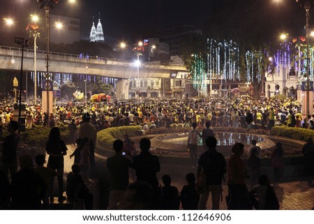 KUALA LUMPUR, MALAYSIA - AUGUST 30: Large crowd of protester at the street rally organized by the Alliance of NGO for democracy in Dataran Merdeka on August 30, 2012 in Kuala Lumpur, Malaysia.