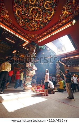 AMPANG, MALAYSIA - OCTOBER 15: Devotees worship the gods at the Nine Emperor God Temple on October 15, 2012 in Ampang, Malaysia. Taoist devotee welcome the god on the eve of the ninth lunar calendar.