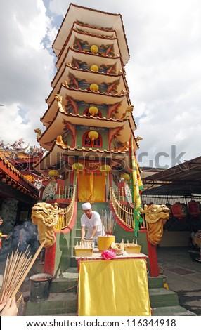 AMPANG, MALAYSIA - OCTOBER 15: Taoist priest worship the gods at the Nine Emperor God Temple on October 15, 2012 in Ampang, Malaysia. Taoist welcome the god on the eve of the ninth lunar calendar.