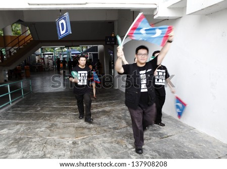 PETALING JAYA, MALAYSIA - MAY 8: Protester walks into the venue of a political rally against Malaysia 13th general election vote result on May 8, 2013 in Stadium MBPJ, Petaling Jaya, Malaysia.