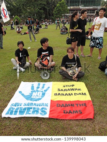 PETALING JAYA, MALAYSIA - MAY 25: Protester with environmental message banner at the protest rally against alleged Malaysia electoral fraud on May 25, 2013 in Padang Timur, Petaling Jaya, Malaysia.