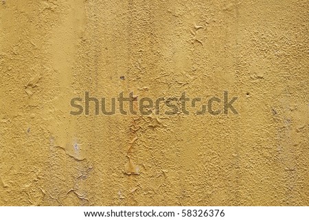 A rustic grungy beige color concrete wall for textural background.