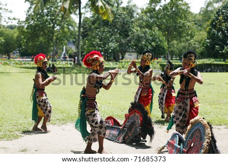 BOROBUDUR, INDONESIA - FEBRUARY 3: Unidentified boys in colorful costume performing Jathilan dance to summon spirit on February 3, 2011 in Borobudur, Indonesia. Jathilan dance is a ancient Java ritual