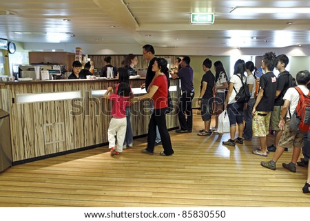 PORT KLANG, MALAYSIA - OCTOBER 1: Visitors at the MV Logos Hope cafe on October 1, 2011 in Port Klang, Malaysia. The 132.5m long ship host the world\'s biggest floating book fair with 5000 book titles.