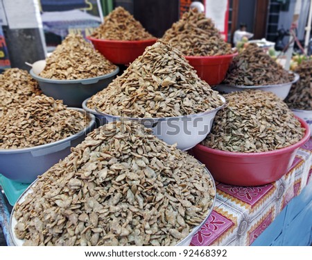 Crunchy fried anchovies on display at a street vendor booth in a street market in Bandung, Indonesia.