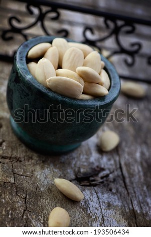 Healthy eating.Peeled almonds nuts on wooden background