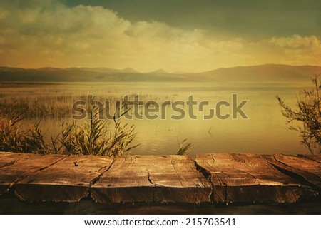 Autumn nature background. Table with Lake and cloudscape art Design. Autumn landscape