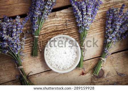 Spa and wellness setting with lavender flowers, floral water and bath salt. Dayspa nature set