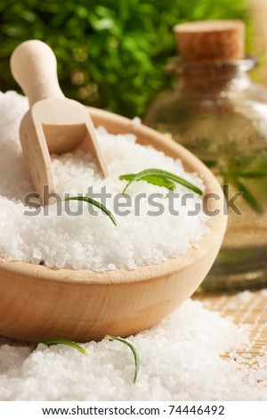 Spa setting with bath salt and floral water.