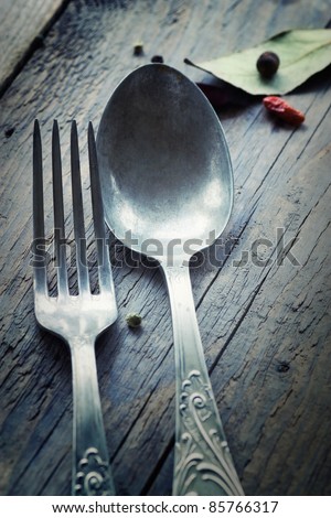 Restaurant menu series. Country place setting. Fork and knife in rustic country table setting. setting