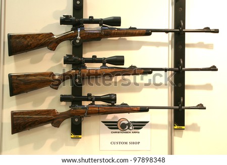 NURNBERG, GERMANY - MARCH 11: Christensen Arms rifles with Swarovski sights on display at IWA 2012 & OutdoorClassics exhibition on March 11, 2012 in Nurnberg, Germany