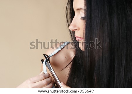 Brunette female pretending to wear a wrench to fix a bra