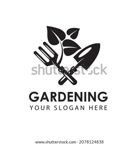 gardening emblem with trowel spade, garden fork and treeisolated on white background